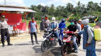 Cegah Penyebaran Covid-19, Pemdes Mekar Jaya Lakukan Penyemprotan Disinfektan